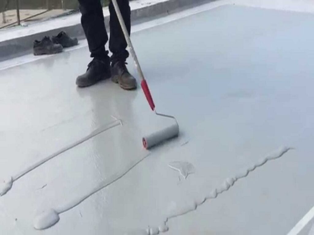 Professional waterproofing contractors working on a terrace in Mumbai